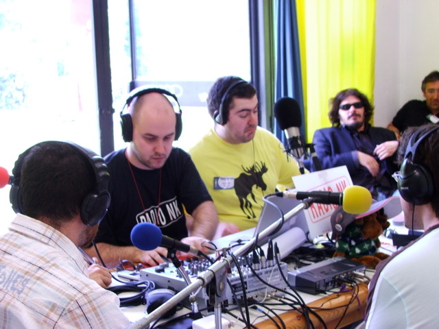 Live podcast recording session at the Raduno Podcaster in Bologna, May 2006, with microphones and mixing equipment